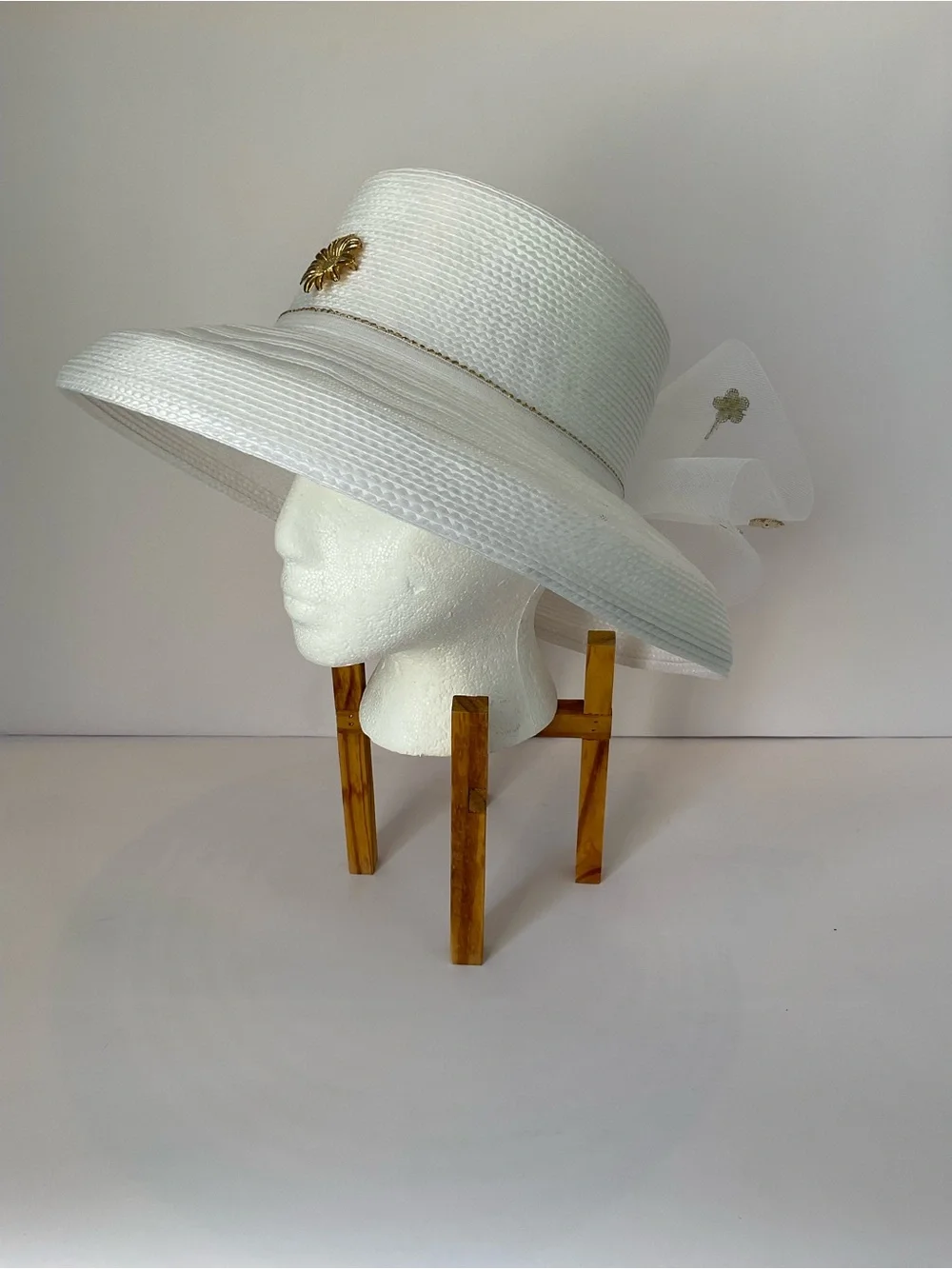 Elegant White Wide-Brim Church Hat with Net Lace Bow and Gold Floral Accent